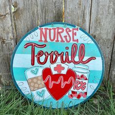 a painted sign that says nurse tortilla next to a wooden fence with the words nurse tortilla on it