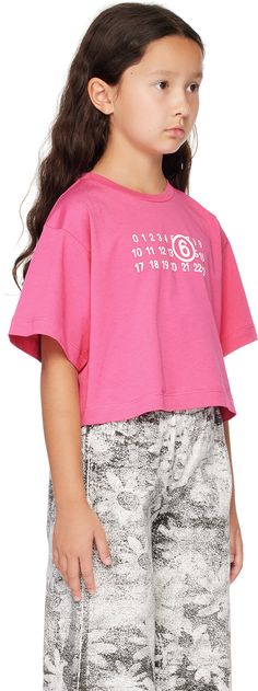 Organic cotton jersey T-shirt. · Rib knit crewneck · Logo printed at front · Cropped hem · Machine-wash Supplier color: Pink Model measures 50 / 127 cm tall and wears size 8Y. MM6 Maison Margiela Size: child's height 4Y: 41.75 / 106 cm 6Y: 47.25 / 120 cm 8Y: 52 / 132 cm 10Y: 56.75 / 144 cm 12Y: 61.5 / 156 cm 14Y: 66.25 / 168 cm 16Y: 71 / 180 cm Summer Cotton Tops With Number Print, Summer Crew Neck Top With Number Print, Cotton Number Print Short Sleeve Tops, Cotton Short Sleeve Top With Number Print, Pink Short Sleeve T-shirt With Number Print, Cotton T-shirt With Number Print, Crew Neck, Crew Neck Cotton Top With Number Print, Crew Neck Cotton T-shirt With Number Print, Cotton Crew Neck T-shirt With Number Print