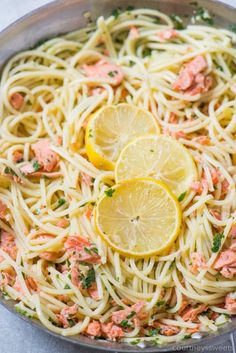 pasta with salmon and lemons in a pan