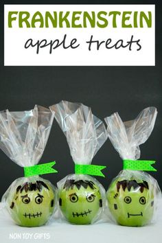 three green apples wrapped in plastic with faces on them and the words, frankenstein apple treats