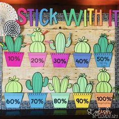 a wooden sign that says stick with it in front of cactuses and other plants