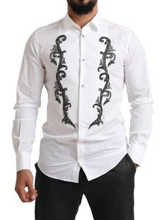 Step into luxury with this 100% Authentic, brand new Dolce & Gabbana dress tuxedo smoking shirt. Exuding elegance and sophistication, this slim fit white shirt with subtle gray baroque detailing is perfect for upscale events. The French cuffs add a classic touch suitable for the most formal occasions. Meticulously crafted in Italy, this shirt isn’t just a piece of clothing; it’s a statement of style. Material: 100% Cotton Color: White Country of origin: Made in Italy Fitting: Slim fit Front butt Dress Tuxedo, Dolce And Gabbana Shirts, Slim Fit Tuxedo, White Tuxedo, Dolce Gabbana Dress, Shirt Model, French Cuff, Tuxedo Dress, Tuxedo Shirts