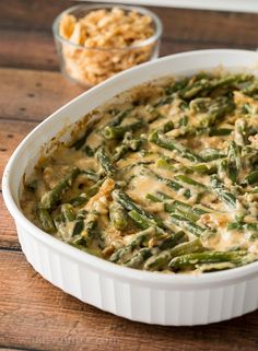 a casserole dish filled with green beans and cheese