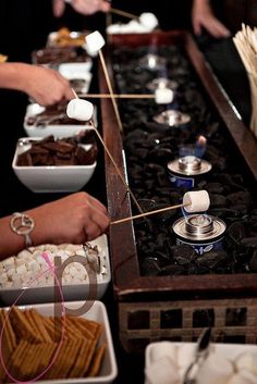 the people are preparing food on the stove