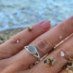 * The story  - Collecting beach treasures is my favourite! You wear something unique that I found in a beach of a Greek island! * Details - It's made of silver 925 and an aqua seaglass - Sea glass dimentions ~ 0,8×0,7 cm - ring size 6 1/4 US (1,65 cm diameter) - This listing is for one piece only. - I don't use wax technics so every piece has a little difference from the other. In the way that I finish them you will see that they are made from a human hand.  * Shipping Ready to ship in 1-2 business days via Hellenic post with tracking number.  * Packaging With the packaging you will receive a summer feeling because every piece is made for summer lovers. Ready to be gifted. Ocean-inspired Silver Rings For The Beach, Minimalist Silver Rings For The Beach, Nickel Free Sterling Silver Rings For Beach, Nickel-free Sterling Silver Rings For The Beach, Silver Sea Glass Ring For Beach, Minimalist Sea Glass Jewelry For Beach, Round Sea Glass Jewelry For Beach, Round Sea Glass Beach Jewelry, Human Hand