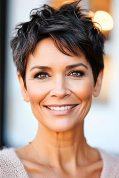 This textured pixie cut is all about the details, with choppy layers that create an effortlessly stylish and modern look. It’s a great low-maintenance style that doesn’t skimp on personality. Click here to see more stunning short hairstyles for women over 50. Pixie Haircut For 50 Year Olds, Earrings With Pixie Haircut, Short Pixie Thick Hair Over 50, Chunky Pixie Haircut, Over The Ear Haircuts For Women, Short Pixie For Thick Hair, Textured Short Haircuts, Choppy Layers For Short Hair, Textured Pixie Cut Thick Hair