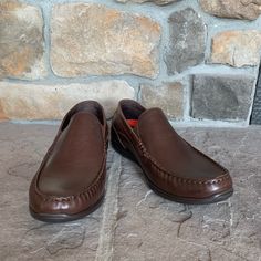 Size 9. New Without Tags, Men’s Rockport Brown Leather Loafer. Brown Casual Moc Toe Dress Shoes, Casual Slip-on Dress Shoes With Ortholite Insole, Casual Slip-on Dress Shoes With Moc Toe, Casual Business Moccasins With Ortholite Insole, Casual Moc Toe Dress Shoes For Business Casual, Rockport Shoes, Brown Leather Loafers, Leather Loafers, Slip Ons