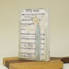 an altered book with sheet music on it