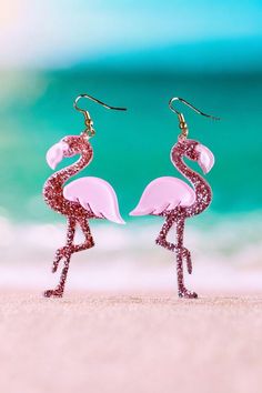 Beautiful Pink Flamingo Earrings.  Made of lightweight acrylic and diamond glitter with fish hook wires.    Perfect for Mardi Gras or any occasion!  Check out the other Styles I offer. Mardi Gras Earrings, Flamingo Earrings, Diamond Glitter, Earrings Pink, Pink Flamingo, Pink Flamingos, Earrings Dangle, Fish Hook, Mardi Gras