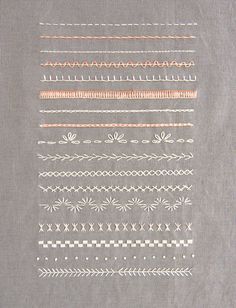 a piece of gray fabric with different designs on the front and back of it,