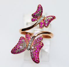 "JEWELRY STORE RETAIL: $5,350 ULTRA FEMININE & FUN 18K BY PASS BUTTERFLY RING!! If you love nature & butterflies you will Love these girls!!. Mother & baby shaded rubies & pink sapphires wings with white diamonds. Their bodies are also bright white diamonds. They flow gracefully on a by pass design, adding to the elegance of these pretty girls. Their just the right size to attract attention yet easy to wear all day. Listing is for ring only. Earrings shown listed separate.  NOTE-on hold, not ava Pink Butterfly Ring For Wedding, Teen Ring, Ruby Color, Ring Ruby, Gem Diamonds, Ultra Feminine, Mother Baby, Detailed Jewelry, Animal Nature