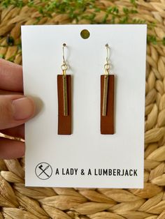 These earrings measure approximately 1/3" wide x 2 1/8" drop (including hook). Made with hypoallergenic 14k gold plated hooks and silicone earring backs, they're perfect for sensitive ears. These are hand crafted from from genuine leather and raw brass which makes such a beautiful combination. Each set is packaged in a brown jewelry box for easy gifting! Our current processing time is 3-5 business days. We ship USPS Ground Advantage with a Priority upgrade available at checkout; both shipping options include tracking which will be sent to you when your order ships.  Need a bulk order or have a custom request? We'd love to hear from you! Please reach out to us at aladyandalumberjack@gmail.com Love your order? We'd love to see it! Please tag us on Instagram @aladyandalumberjack. Adjustable Drop Earrings For Everyday Use, Nickel Free Drop Earrings For Everyday Use, Nickel-free Drop Earrings For Everyday, Everyday Use Nickel-free Dangle Earrings, Everyday Nickel Free Dangle Earrings, Brown Dangle Jewelry For Everyday, Brown Rectangular Earrings With Ear Wire, Dangle Earrings For Everyday Use, Brown Drop Earrings For Everyday