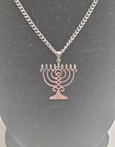 Stainless steel menorah necklace Width: 24.5mm Height: 27mm Chain length: 45cm Silver Sterling Silver Necklace For Hanukkah, Hanukkah Sterling Silver Silver Necklace, Silver Star Of David Necklace For Hanukkah, Pomegranate Necklace, Red Pomegranate, Menorah, Pearl Flower, Stainless Steel Pendant, Flower Earrings Studs