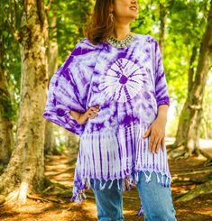 Indulge in the unique charm of our hand-dyed tunic top, meticulously crafted for those who appreciate exceptional fashion. Made from 100% breathable and comfy rayon, this stunning piece is designed to elevate your style while ensuring absolute comfort. Our tunic top stands out with its one-of-a-kind hand-dyed method, guaranteeing that no two pieces are exactly alike. Embracing a loose silhouette, it offers a versatile fit that flatters a wide range of sizes, from S to 2XL. With its side-stitched Bohemian Poncho With Natural Dye, One Size, Bohemian Poncho With Natural Dye, One Size Bohemian Purple Poncho, Bohemian Purple Cover-up For Festival, Bohemian Purple Festival Cover-up, Bohemian Hand Dyed Kaftan For Festivals, Bohemian Hand-dyed Kaftan For Festival, Spring Bohemian Hand Dyed Kaftan, Spring Bohemian Hand-dyed Kaftan