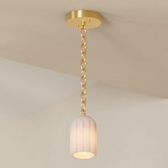 a light that is hanging from the ceiling in a room with a chain on it