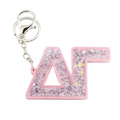 a pink and purple letter shaped keychain with flowers on it's side