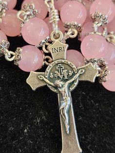 Beautiful handcrafted rosary.  These are made with 8mm baby pink glass  beads.  each bead is capped to add elegance and a nice finish.   The beads are smooth and very cool to the touch.   The centers and cross is from Italy and are high quality and very detailed.   I meticulously connect each bead with non tarnish Artistic Wire.  quality wire and quality beads. Handmade Pink Rosary With Round Beads, Pink Beaded Spiritual Rosary, Pink Rosary With 8mm Round Beads, Pink Spiritual Rosary Bracelet With 8mm Beads, Pink Beaded Rosary With Round Beads, Pink 8mm Bead Spiritual Rosary Bracelet, Pink 8mm Beads Rosary Bracelet, Handmade Pink Spiritual Rosary, Pink Rosary With Round Beads For First Communion