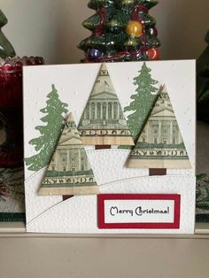 a christmas card with two trees on it