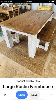 a wooden table with two benches on top of it in a room filled with furniture