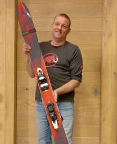 a man holding a snowboard in his hand