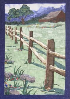 a quilted wall hanging with a wooden fence