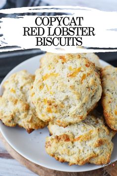 some biscuits on a white plate with the words copycat red lobster biscuits above it