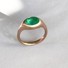 Formal Rose Gold Oval Emerald Ring, Formal Oval Emerald Ring In Rose Gold, Modern Green Oval Rings, Modern Emerald Oval Signet Ring, Oval Emerald Ring With Tension Setting In Fine Jewelry, Modern Oval Emerald Ring For May Birthstone, Emerald Ring, Matte Gold, Ring Size 7