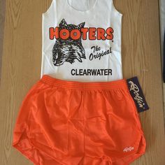 This Is For A Brand New Hooters Girl Vintage Look Uniform Tank & A New Pair Of Dolfin Shorts. Tank Is Cotton Soft Stretchy And A Size Medium And The Shorts Are Silky Soft And A Size Medium Rare Find The Vintage Original Look Ck Out My Other Hooters Outfits White Cotton Cheerleading Bottoms, White Cheerleading Shorts For Summer, White Summer Cheerleading Shorts, White Cotton Bottoms For Cheerleading, Hooters Uniform, Girl Uniform, Great Halloween Costumes, Stretchy Shorts, Money Pouch