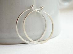 Simple and timeless sterling silver hoop earrings made with thick gauge sterling silver wire. Each pair hand made to order. They are 1 1/4 inch in diameter, hammered flat for strength and look. Finish with high shine polished. The best gift that cant go wrong!! Great simple accessories for everyday! Simple Hoop Earrings, Hammered Hoop Earrings, Sterling Silver Hoop Earrings, Sea Glass Jewelry, Sterling Silver Hoops, Online Jewelry Store, Rose Gold Earrings, Earrings Etsy, Jewelry Earrings Hoops