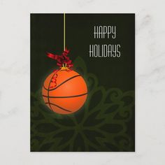 an orange christmas ornament hanging from a red ribbon on a green background with the words happy holidays