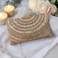 Introducing our exquisite Handmade Crystal Evening Clutch, a dazzling accessory fit for a bride's special day! 🌟 Handcrafted Elegance: Each clutch is meticulously handmade by skilled artisans, ensuring the utmost attention to detail and quality. ✨ Sparkling Crystals: Adorned with shimmering crystals that catch the light with every movement, this clutch adds a touch of glamour to your bridal ensemble. 👛 Perfect Size: With a roomy interior to hold your essentials - from keys, makeup to your phon Luxury Handmade Clutch For Receptions, Traditional Luxury Handmade Clutch, Camel Clutch, Fancy Clutch, Luxury Clutch, Bridal Elegance, White Clutch, Handmade Clutch, Wedding Clutch