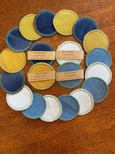 a bunch of blue and yellow plates sitting on top of a wooden table