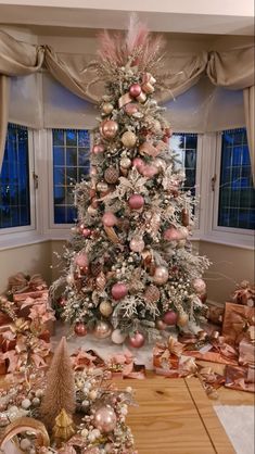 a decorated christmas tree in a living room