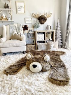 a stuffed animal laying on top of a white rug