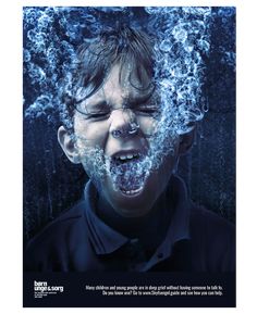 a young boy with his face covered in water