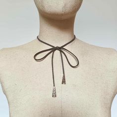 Fashion trend suede vegan leather choker necklace with bow 🌼 Choker length in 2 sizes,  small/ regular and large/ extra large (12" and 14" ) just choose for perfect fit ( your neck size)  🌼 Made of soft vegan suede leather 🌼 The bow is already attached to the choker, no need to tie yourself ( it is handsew, not glued)  🌼Adjustable -- Lobster clasp closure with 3" adjustable extension chain - will fit perfect on your neck 🌼 with silver gray end cords accesories 🌼 For special sizes please message me It is perfect to wear with corset, evening, party or prom dress, also a perfect romantic gift.  Find more accessories here in my shop : https://www.etsy.com/shop/HouseOfTooFan Please note that due to lighting effects, monitor's brightness, contrast and other settings, there might be some sl Adjustable Brown Trendy Choker, Trendy Adjustable Brown Choker, Brown Adjustable Choker, Fall Color Trend, Bow Choker, Leather Choker Necklace, Leather Chokers, Fall Color, Romantic Gift