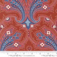 a red and blue paisley print fabric