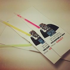 two envelopes with darth vader and light saber on them