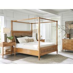 a bed sitting in a bedroom next to a dresser