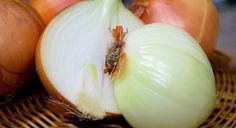 an onion and two onions on a wicker basket