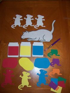 various cut out animals and shapes on a wooden floor