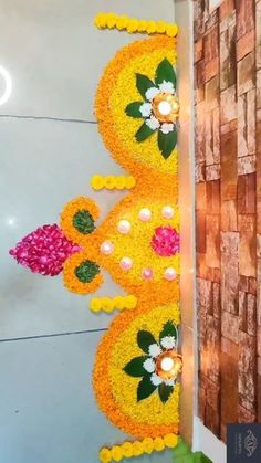 the wall is decorated with flowers and leaves