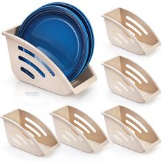 six pieces of plastic dishes in a holder with blue plates and silverware on them