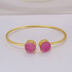 Gold Plated Bangle - Pink Druzy Bangle - Round Stone Bangle - Fashion Bangle - Adjustable Bangle - Sleek Bangle - Brass Bangle- Women BangleProduct DetailsItem Code: IAJBB-1362Gross Wt. 10.00 GmsStone Name:  Pink DruzyStone Shape : RoundStone Size : 10 mmMetal: 18K Yellow Gold Plated Over BrassBracelet Inner diameter : 2.50" InchPlease view my full collection of ? Druzy ?:https://www.etsy.com/in-en/shop/Bhagatjewels?ref=hdr_shop_menu&search_query=DruzyShipping Info:All my items are safely an Adjustable Pink Bangle As A Gift, Pink Round Cuff Bracelet For Gifts, Pink Adjustable Bangle For Gift, Adjustable Pink Bangle For Gift, Trendy Adjustable Pink Bangle, Handmade Adjustable Pink Bangle, Cheap Adjustable Pink Bangle, Adjustable Handmade Pink Bangle, Adjustable Pink Metal Bangle