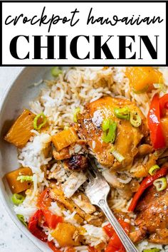 a white bowl filled with chicken and rice next to a fork on top of it