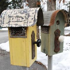 two mailboxes are painted yellow and brown