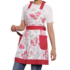 a woman wearing an apron and holding a spatula