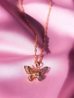 ✨ITEM DETAILS✨ The sweetest butterfly necklace featuring a cute cubic zircon diamond. 18K Gold plated. You can pair it with our matching Mariposa hoops!  ✧Chain length: 45 cm waterwave chain ✧Pendant size: 2cm*1.3cm ✧18K Gold plated pendant ✧Gold filled chain ✧Lead and Nickel free ✨SHIPPING✨ ✧ UNITED STATES: Free Tracked Shipping ✧ CANADA:  Free Untracked Shipping. You can upgrade to tracking                         at checkout. ✧ INTERNATIONAL: $8.50 Tracked shipping Dainty Gold-plated Butterfly Necklace, Gold Plated Butterfly Necklace With Delicate Chain, Gold Plated Butterfly Necklace, Gold Butterfly Necklace With Delicate Chain For Party, Gold Butterfly Pendant Necklace For Party, Gold Butterfly Necklace For Party, Dainty Butterfly Charm Necklace For Party, Gold Cubic Zirconia Butterfly Necklace With Clavicle Chain, Gold Butterfly Pendant Necklace In Cubic Zirconia