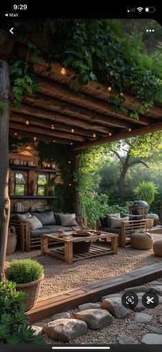 an outdoor living area with wooden furniture and plants