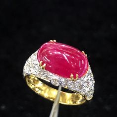 BRAND-NEW!! ONE OF A KIND, HANDCRAFTED RING. EXTREMELY ELEGANT, UNIQUE style, 6.89 carats Certified, GORGEOUS RED RUBY ring. This ring offers an important statement of who you are with a JUMBO 5.35 carats, VIVID RED, TRANSLUCENT CABOCHON, BURMESE RUBY. Accentuating the RUBY are the 60 E/VVS, and sparkling natural diamonds THE ITEM YOU SEE IN THE PICTURES IS THE EXACT ITEM YOU WILL GET! ONE OF A KIND, NO DUPLICATES OR TWINS SUGGESTED RETAIL VALUE: $12,500 RUBY: Weight: 5.35 carats Shape: OVAL Cab Luxury Ruby Ring With Vvs Clarity, Luxury Ruby Ring With Round Cut Gemstone, Luxury Diamond Ruby Ring, Luxury Ruby Ring With Diamonds, Gold Gia Certified Ruby Ring, Luxury Ruby Halo Ring, Formal Oval Ruby Ring With Single Cut Diamonds, Luxury Yellow Gold Ruby Ring With Center Stone, Luxury Brilliant Cut Ruby Ring